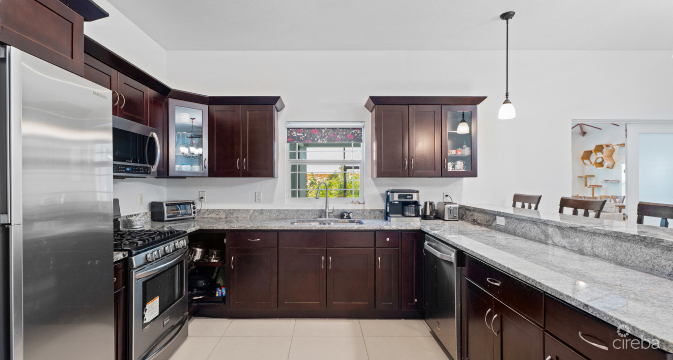 Spacious West Bay Family Home With Modern Extension, Mature Garden & Pickleball Court