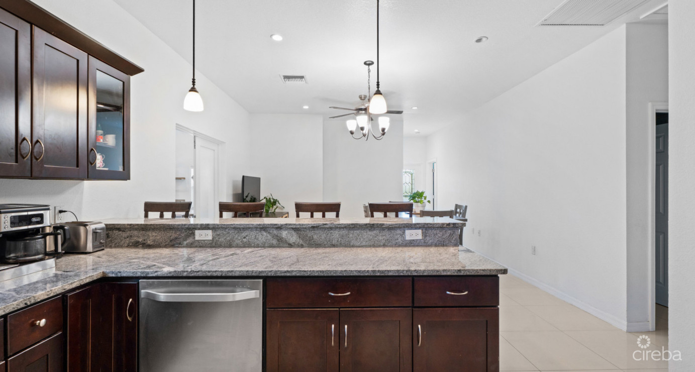 Spacious West Bay Family Home With Modern Extension, Mature Garden & Pickleball Court