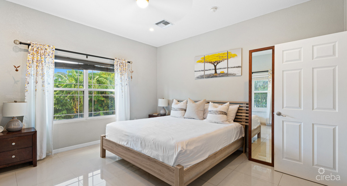 Spacious West Bay Family Home With Modern Extension, Mature Garden & Pickleball Court