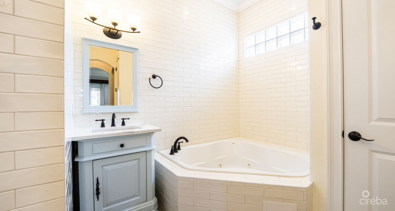 Gated Bimini Drive, Grand Harbour, Single Level 4 Bed Canal Front Home Reduced And Owner Financing!