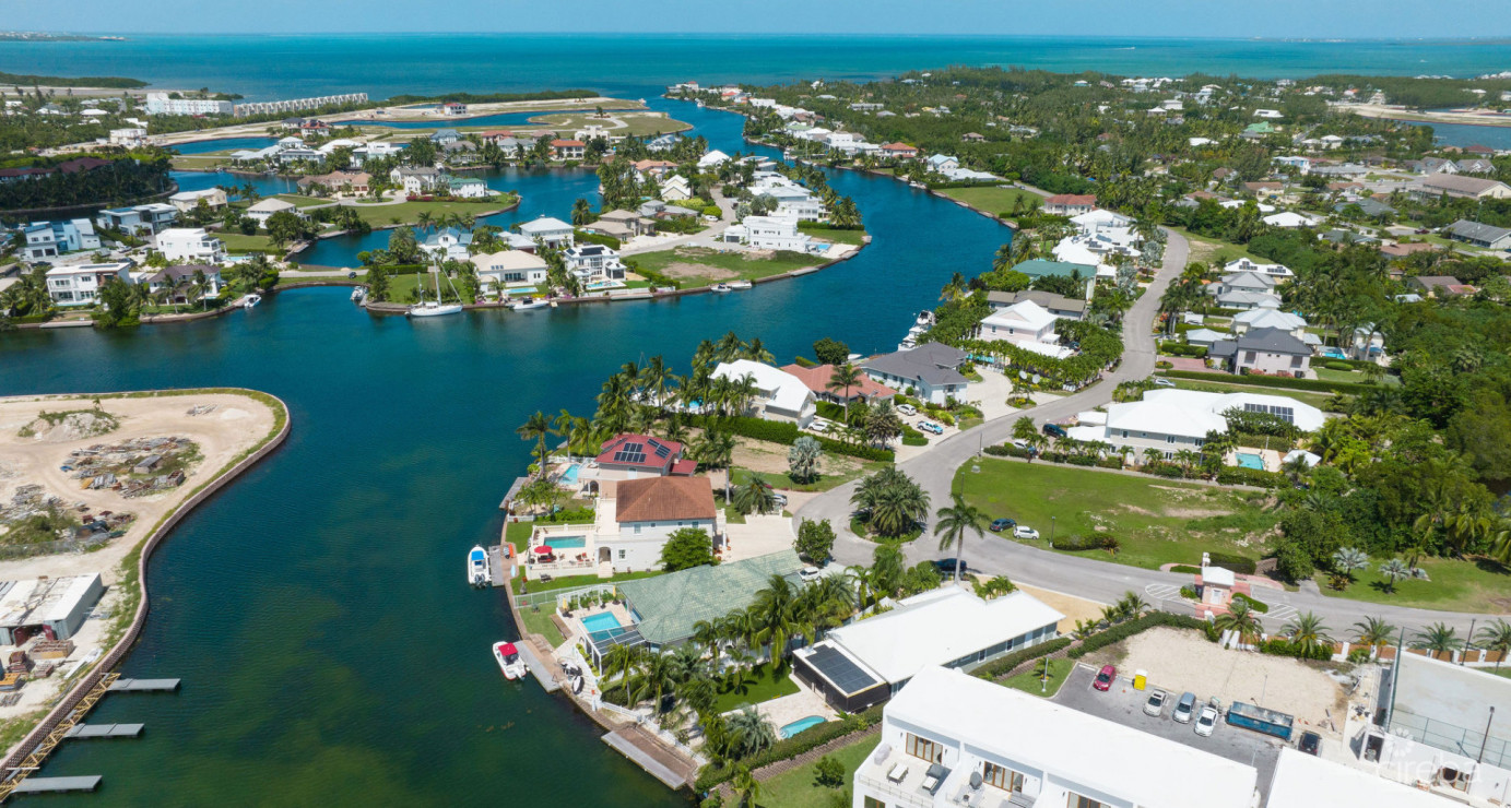 Gated Bimini Drive, Grand Harbour, Single Level 4 Bed Canal Front Home Reduced And Owner Financing!