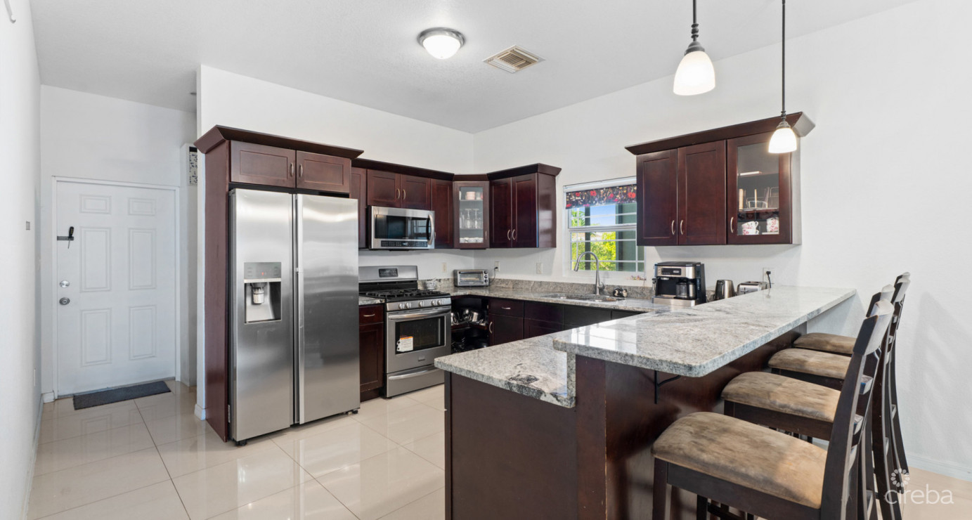 Spacious West Bay Family Home With Modern Extension, Mature Garden & Pickleball Court