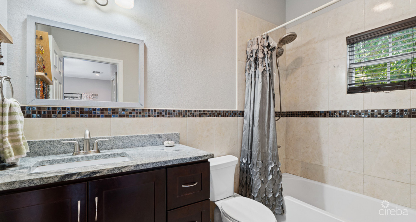 Spacious West Bay Family Home With Modern Extension, Mature Garden & Pickleball Court