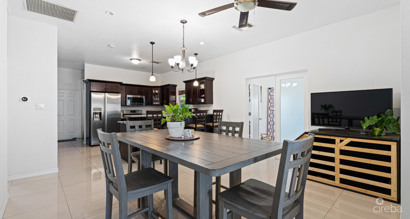 Spacious West Bay Family Home With Modern Extension, Mature Garden & Pickleball Court