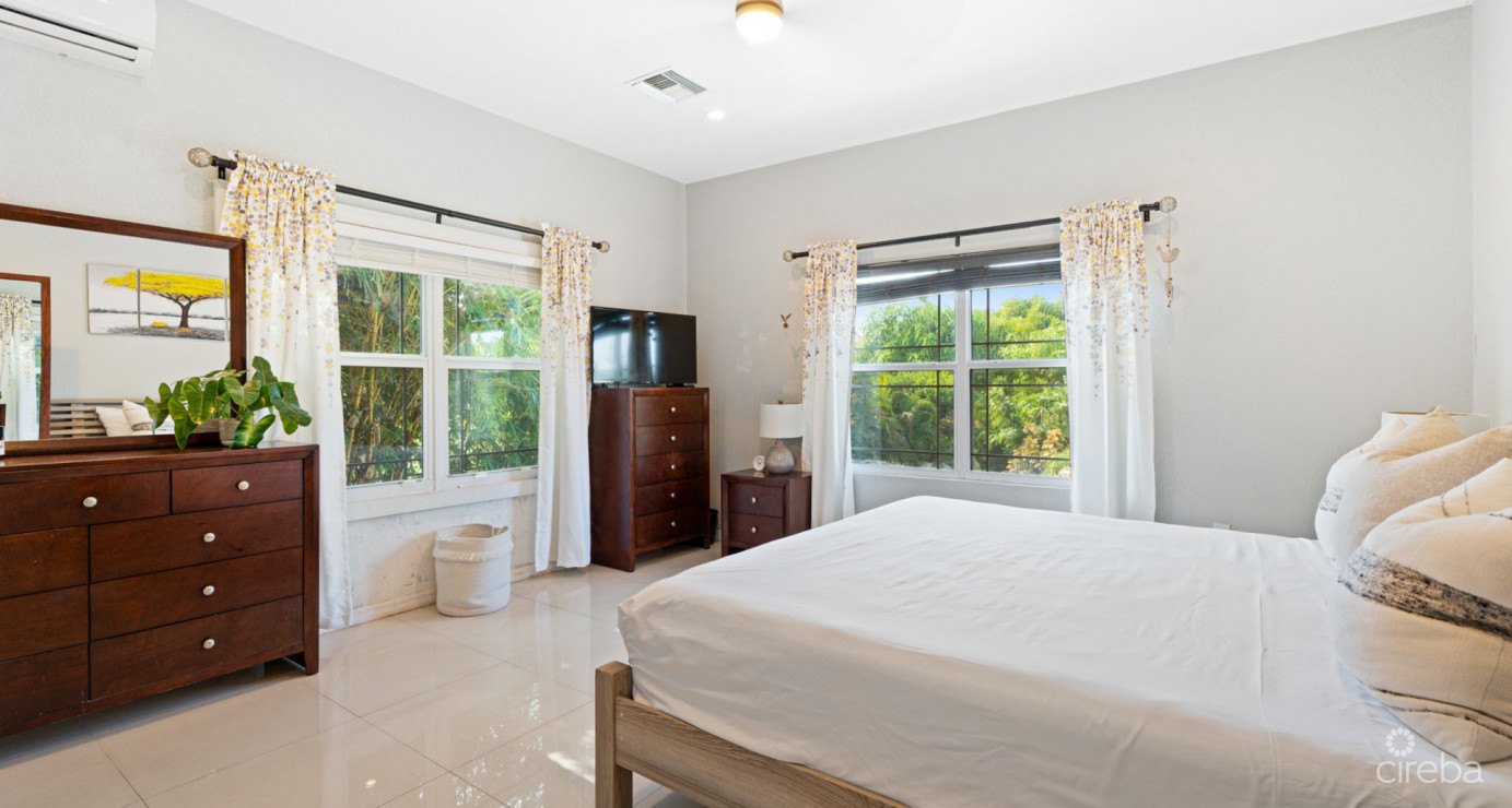 Spacious West Bay Family Home With Modern Extension, Mature Garden & Pickleball Court