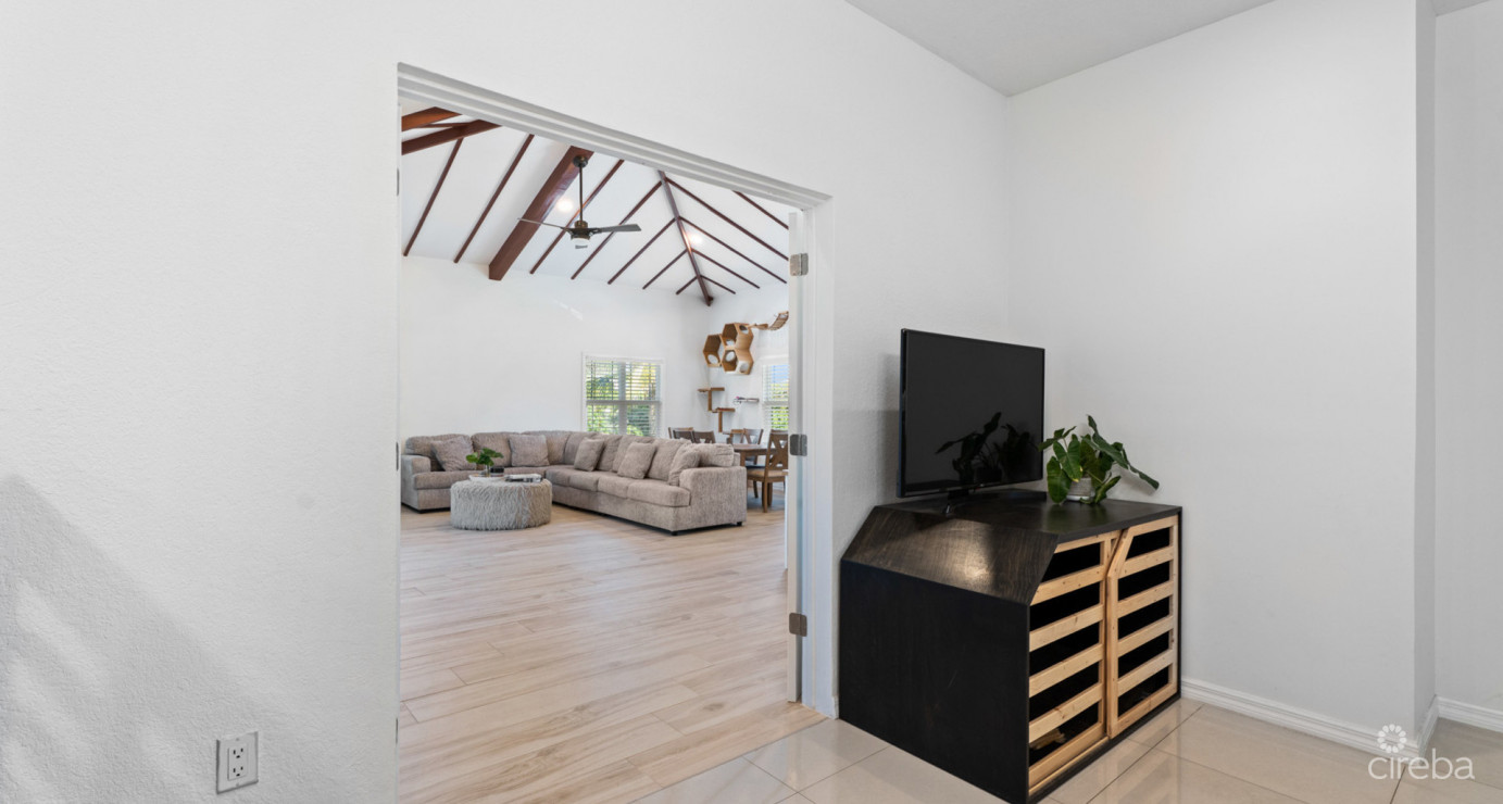 Spacious West Bay Family Home With Modern Extension, Mature Garden & Pickleball Court