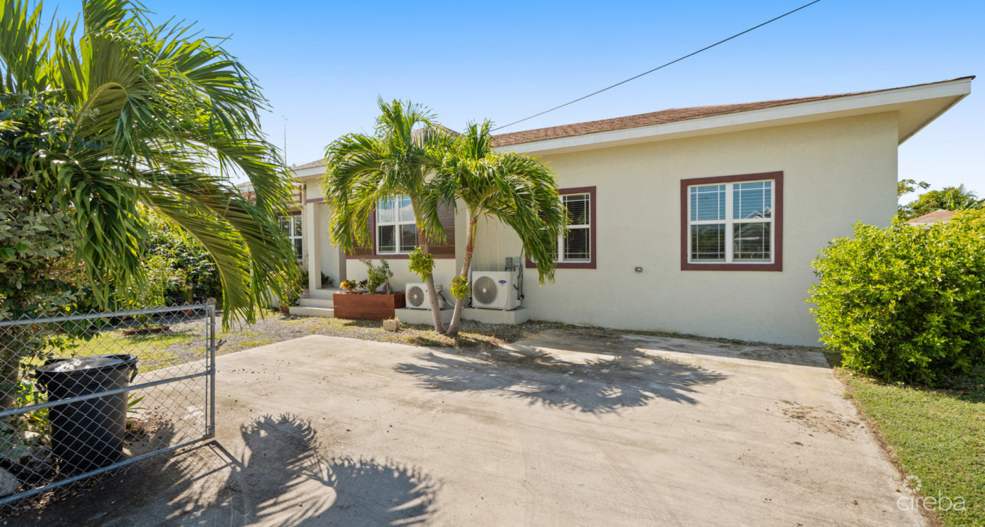 Spacious West Bay Family Home With Modern Extension, Mature Garden & Pickleball Court