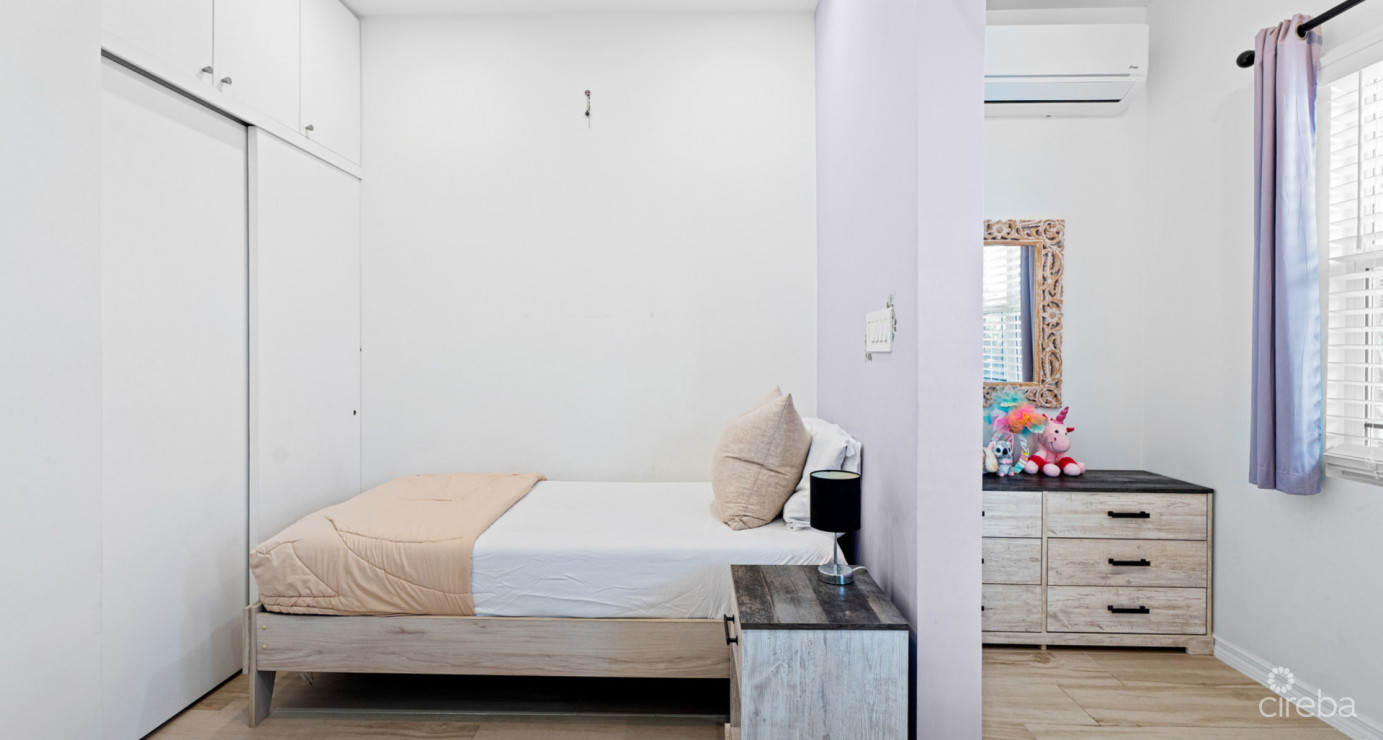 Spacious West Bay Family Home With Modern Extension, Mature Garden & Pickleball Court