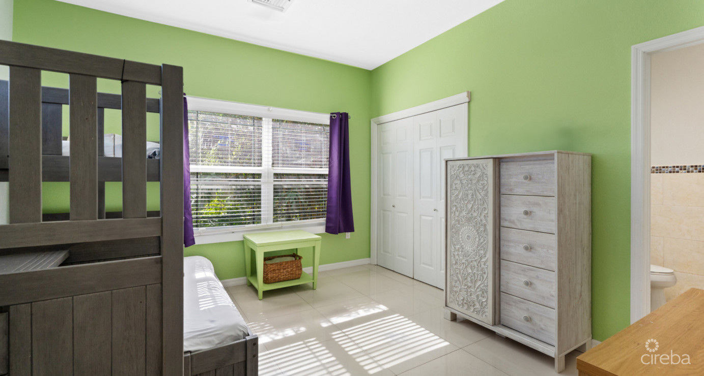 Spacious West Bay Family Home With Modern Extension, Mature Garden & Pickleball Court