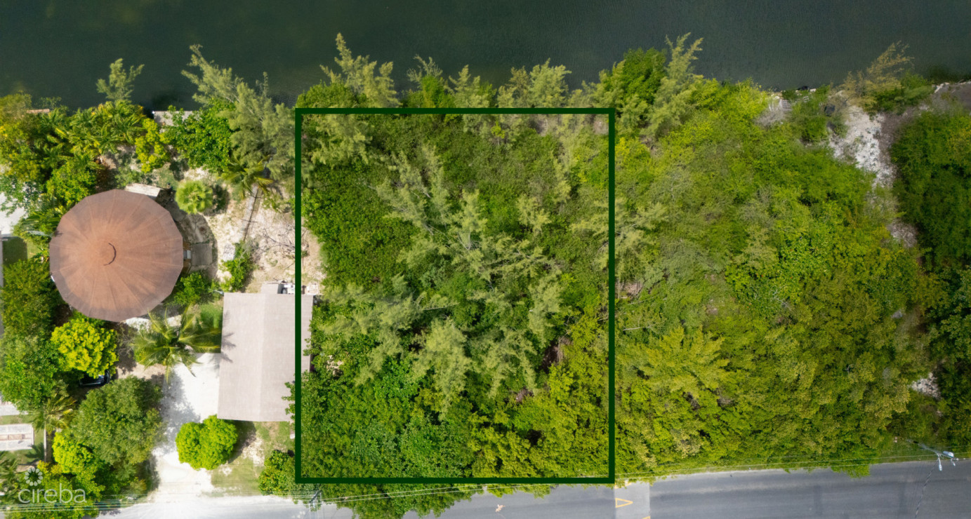 Omega Bay Canal Front Duplex/house Parcel (0.2984 Acre)