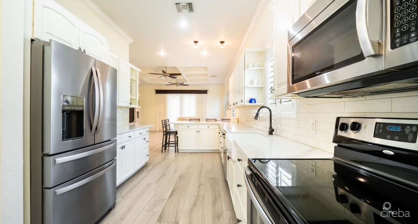 Gated Bimini Drive, Grand Harbour, Single Level 4 Bed Canal Front Home Reduced And Owner Financing!