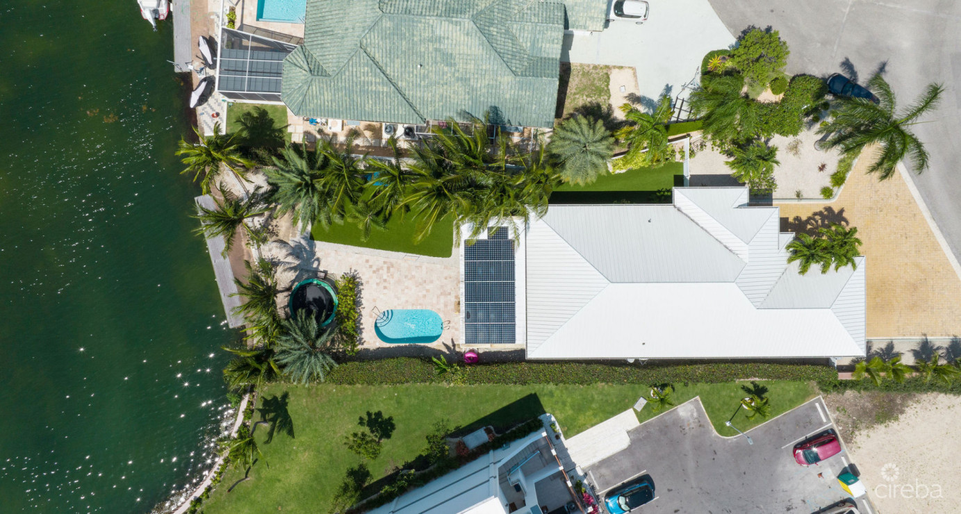 Gated Bimini Drive, Grand Harbour, Single Level 4 Bed Canal Front Home Reduced And Owner Financing!