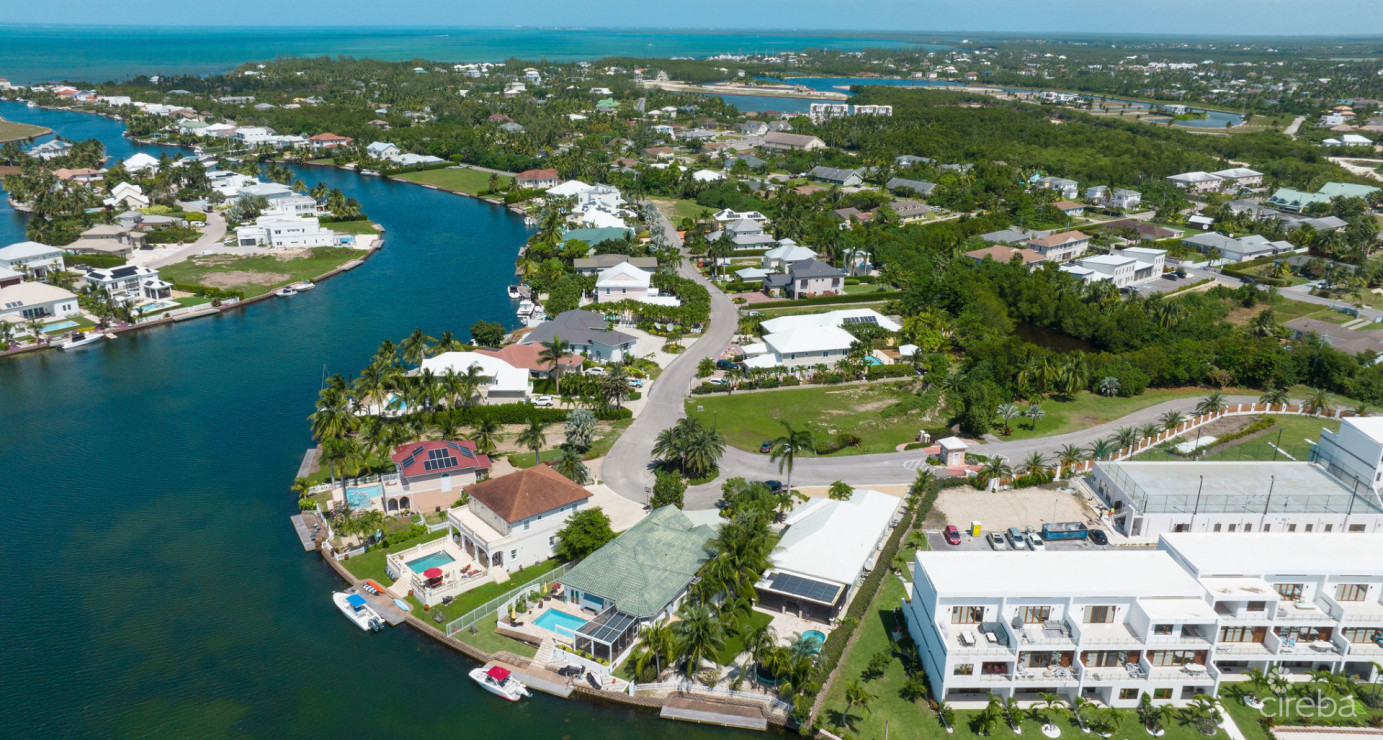 Gated Bimini Drive, Grand Harbour, Single Level 4 Bed Canal Front Home Reduced And Owner Financing!
