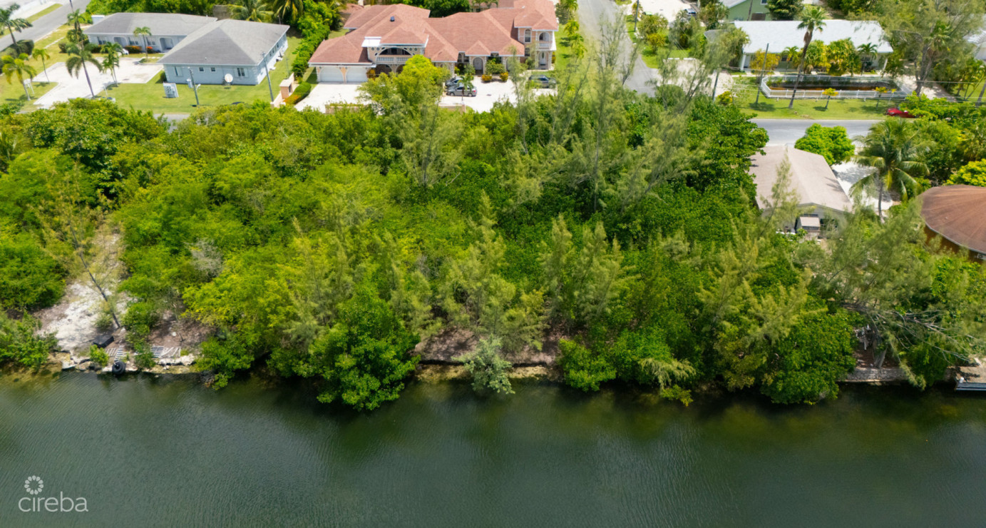 Omega Bay Canal Front Duplex/house Parcel (0.2984 Acre)