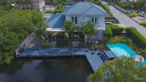 Sun Rose Canal Front Home - North Sound Estates